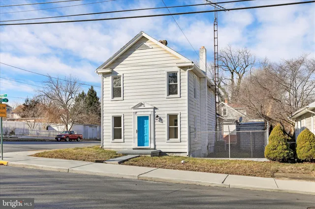 a view of a house with a street