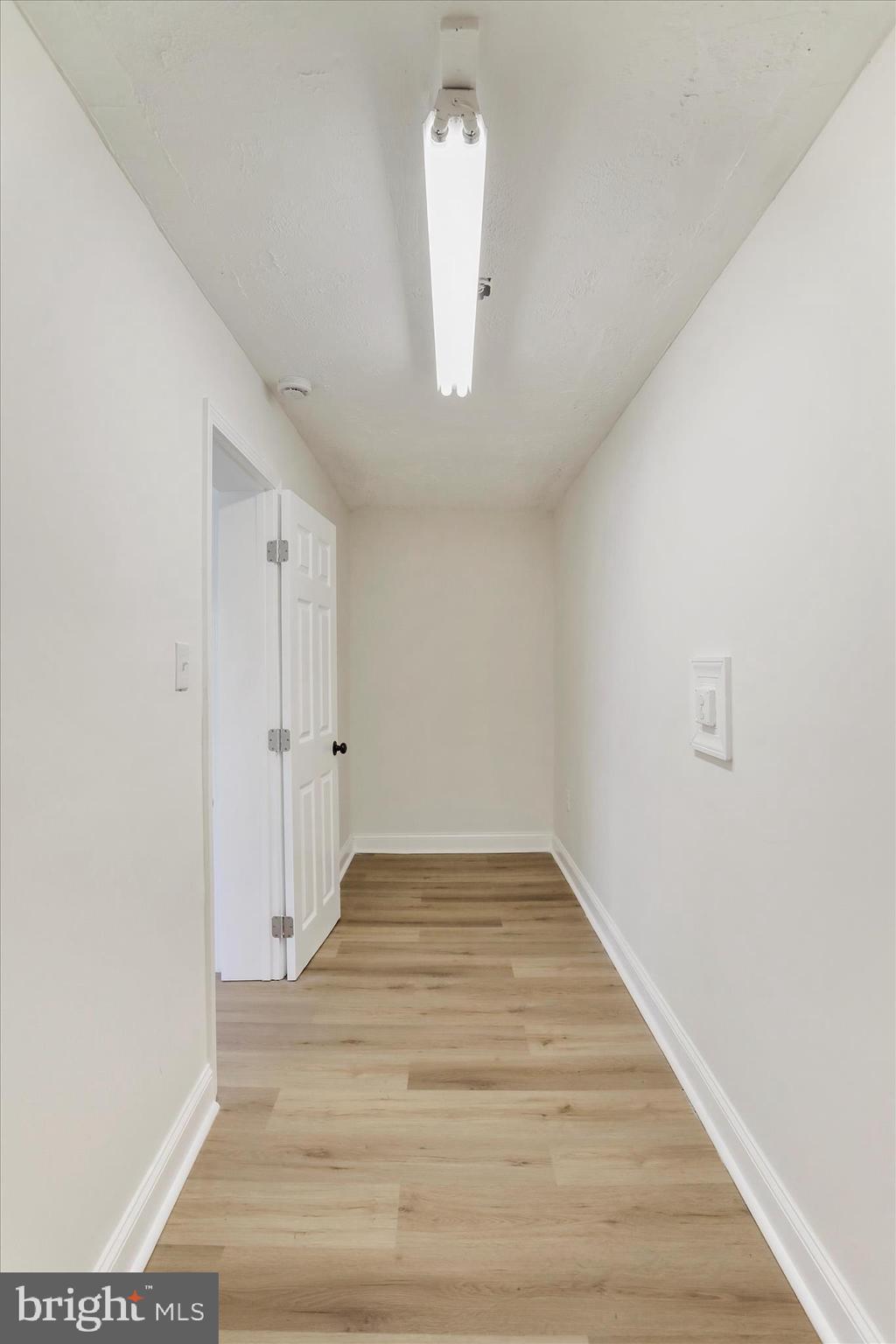 641 South Raleigh Street Martinsburg, WV 25401 - Photo 11 of 34 a view of an empty room with wooden floor and a window
