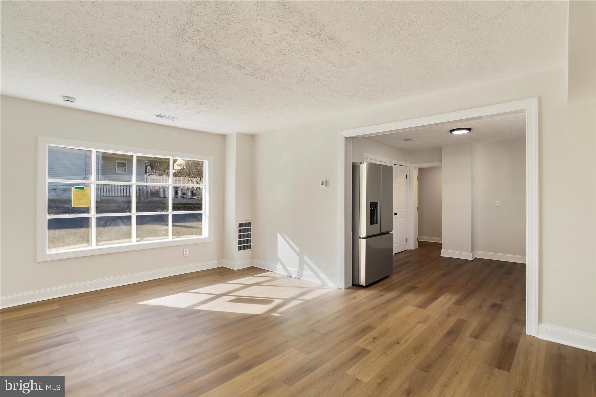 641 South Raleigh Street Martinsburg, WV 25401 - Photo 14 of 34 a view of empty room with wooden floor and windows