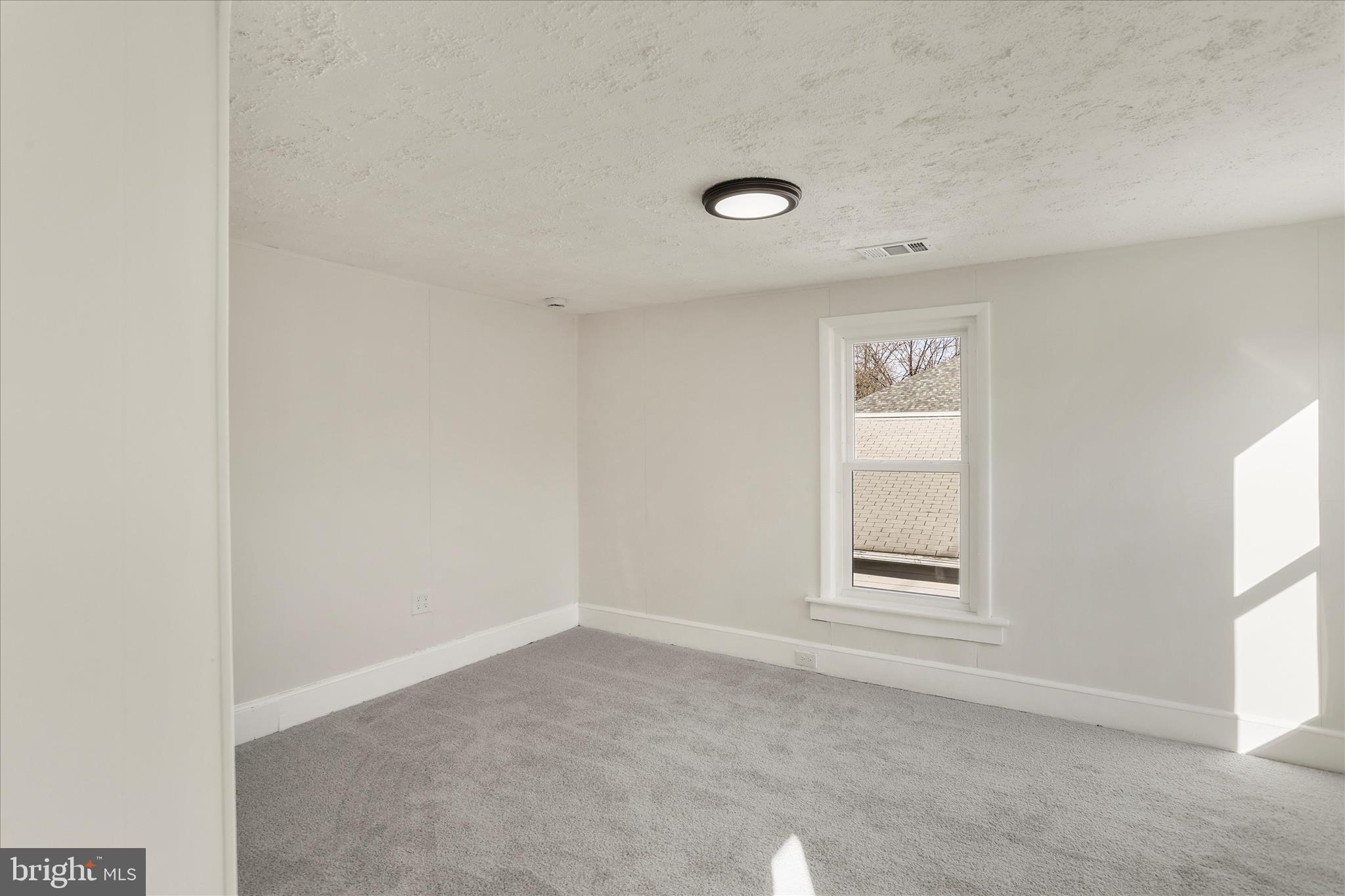 641 South Raleigh Street Martinsburg, WV 25401 - Photo 20 of 34 an empty room with windows