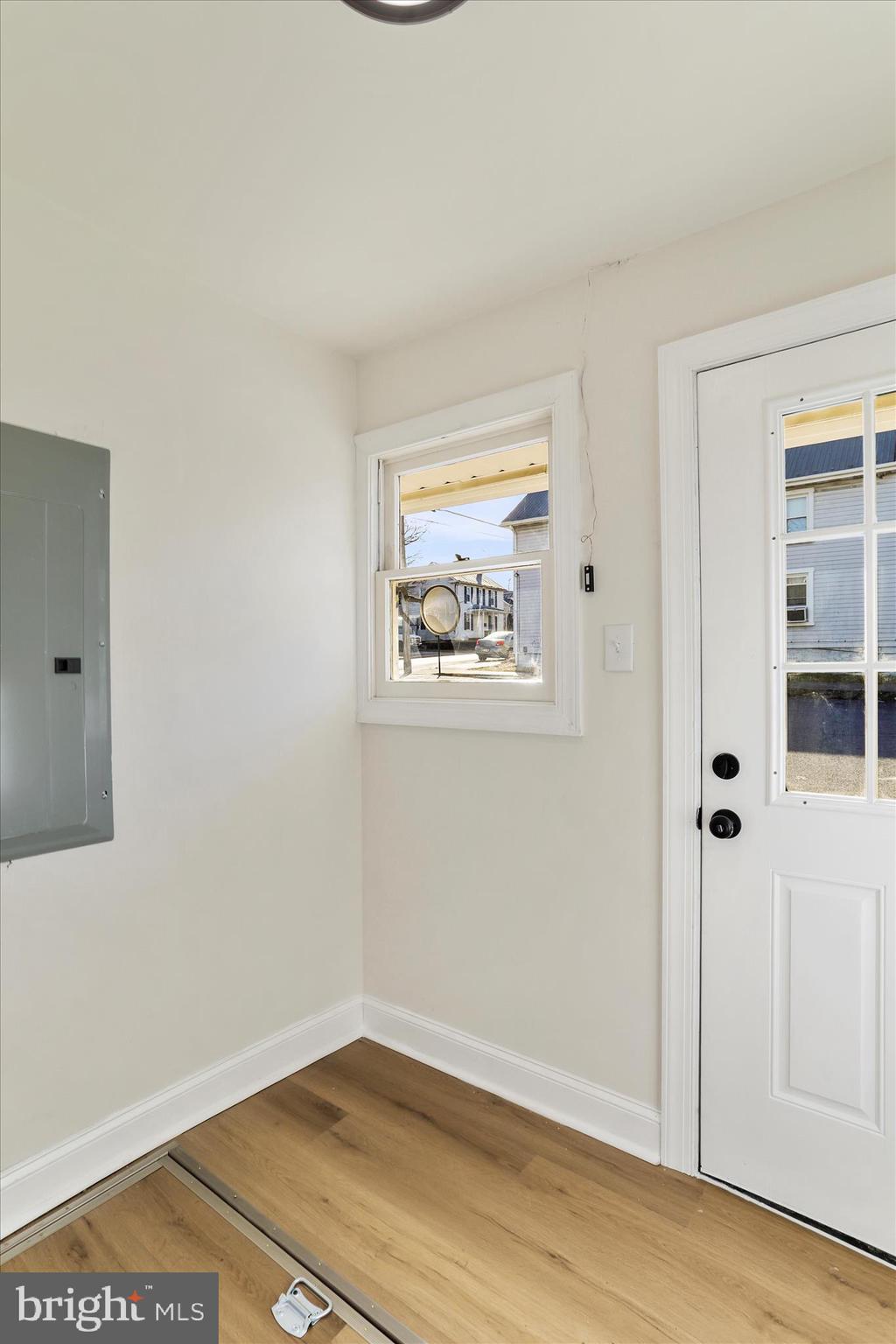 641 South Raleigh Street Martinsburg, WV 25401 - Photo 4 of 34 an empty room with wooden floor and windows