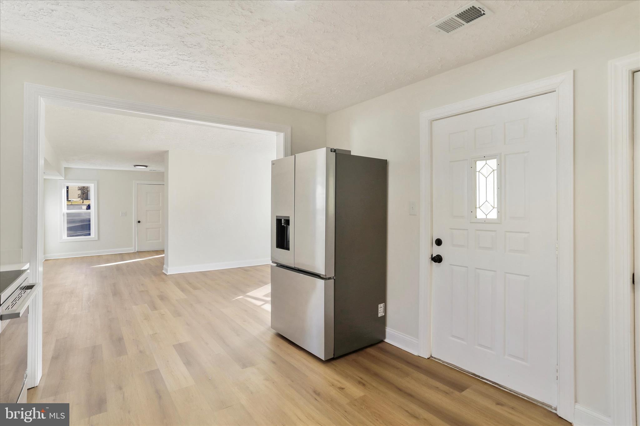 641 South Raleigh Street Martinsburg, WV 25401 - Photo 7 of 34 a view of a kitchen with wooden floor and refrigerator