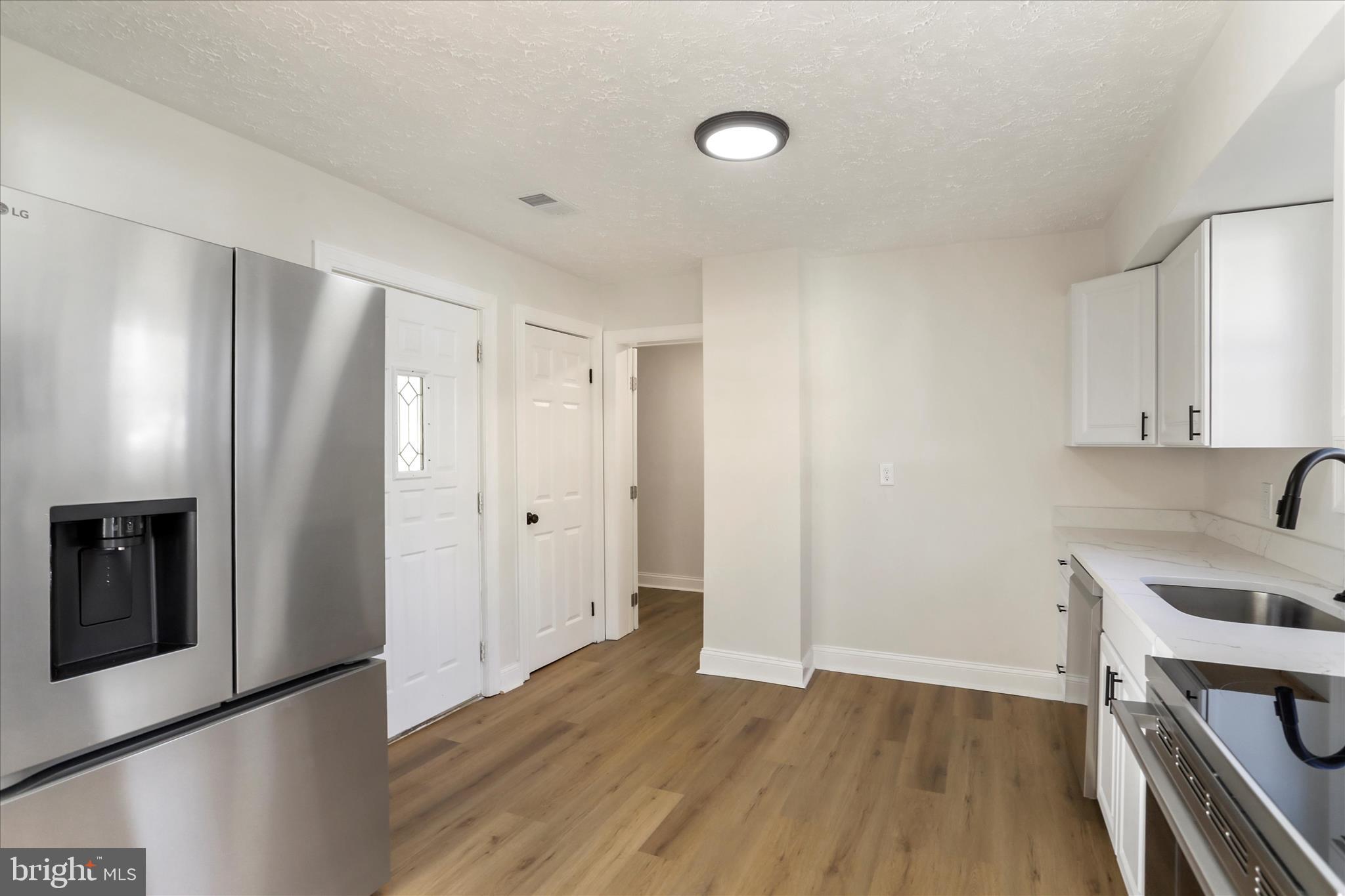 641 South Raleigh Street Martinsburg, WV 25401 - Photo 9 of 34 a view of kitchen with wooden floor and electronic appliances