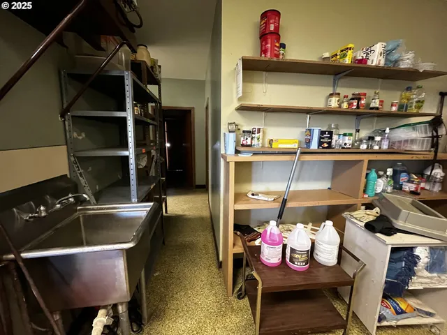 a kitchen with a stove and cabinets