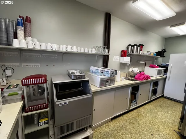 a kitchen with a stove and a sink