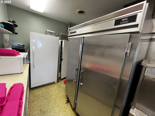 a bathroom with a tub and shower