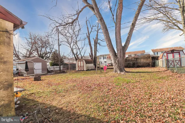 an outdoor space with lots of furniture and umbrella