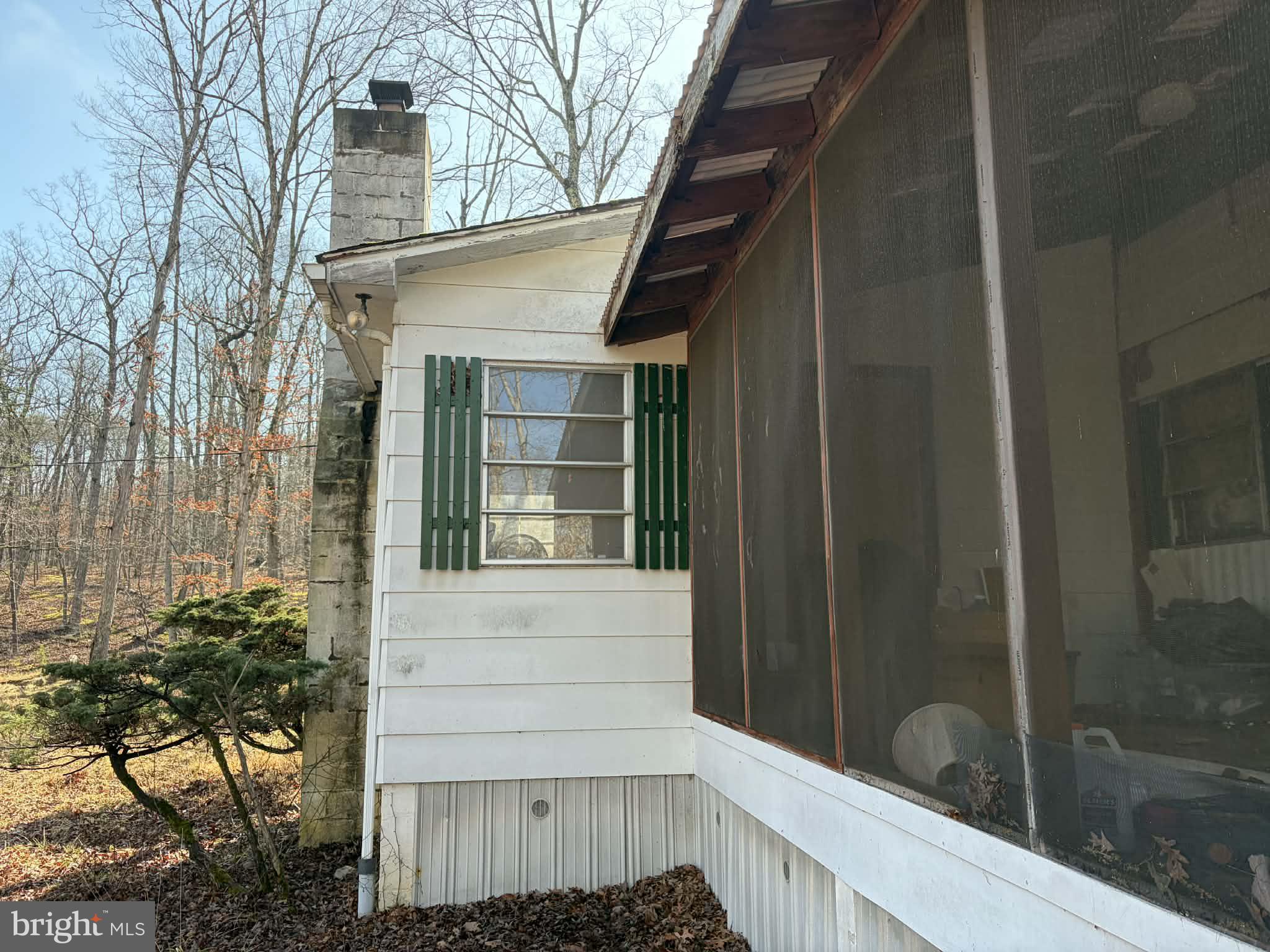 6427 Back Creek Road High View, WV 26808 - Photo 12 of 14 a view of a house with a door and wooden bench