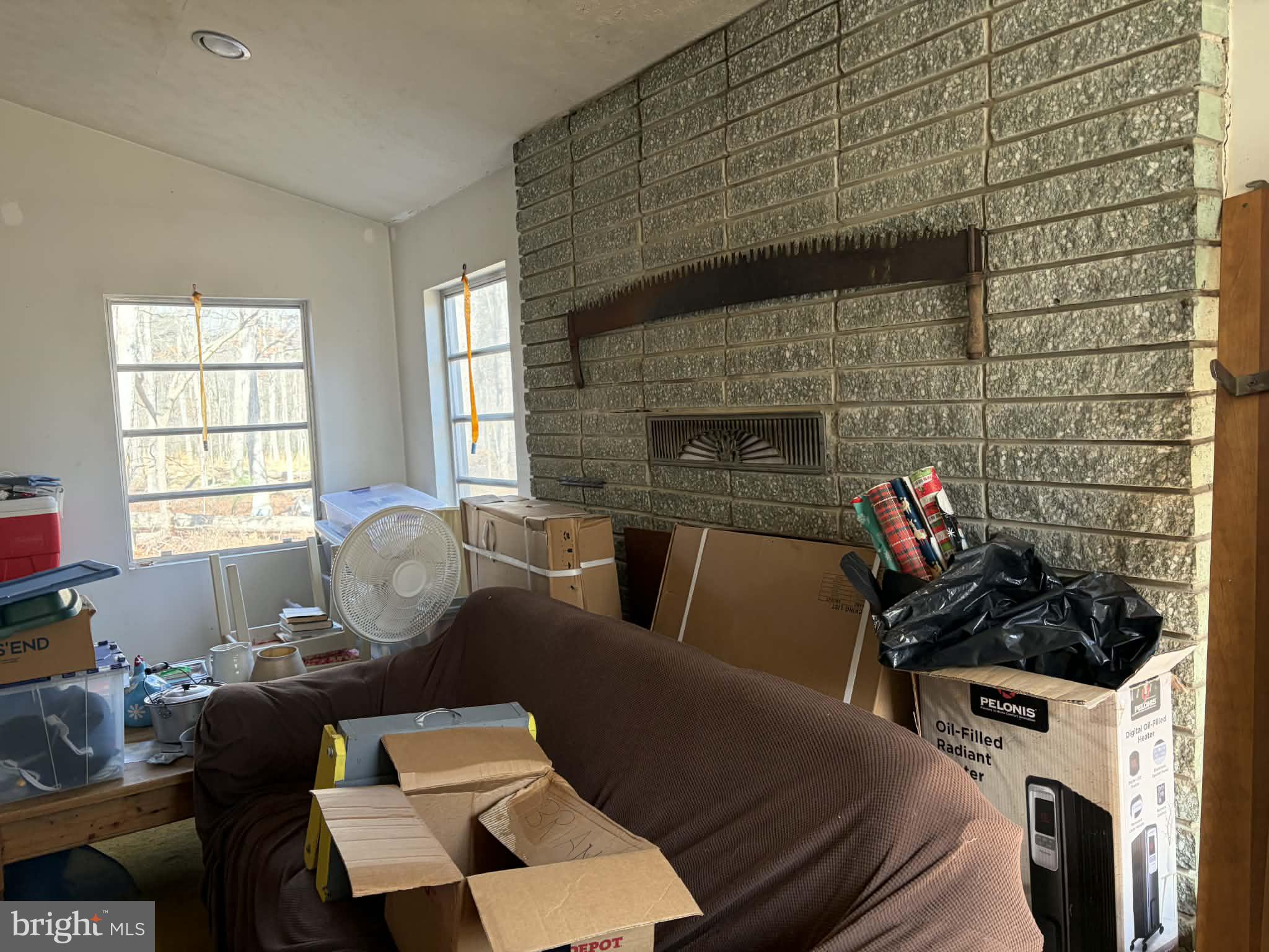 6427 Back Creek Road High View, WV 26808 - Photo 3 of 14 a living room with furniture a fireplace and a table
