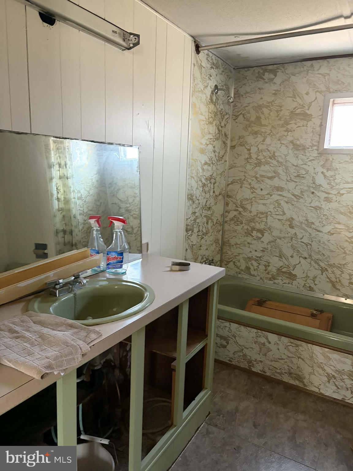 6427 Back Creek Road High View, WV 26808 - Photo 10 of 14 a bathroom with a granite countertop sink a toilet and bathtub