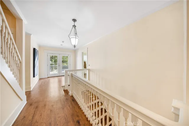 a view of an entryway with wooden floor