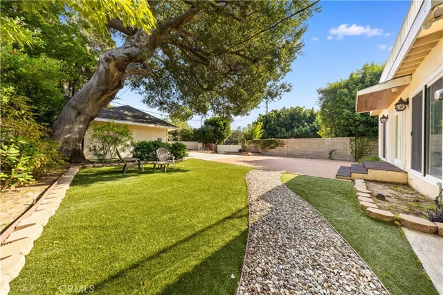 a house view with a garden space