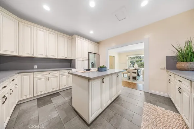a kitchen with sink and cabinets