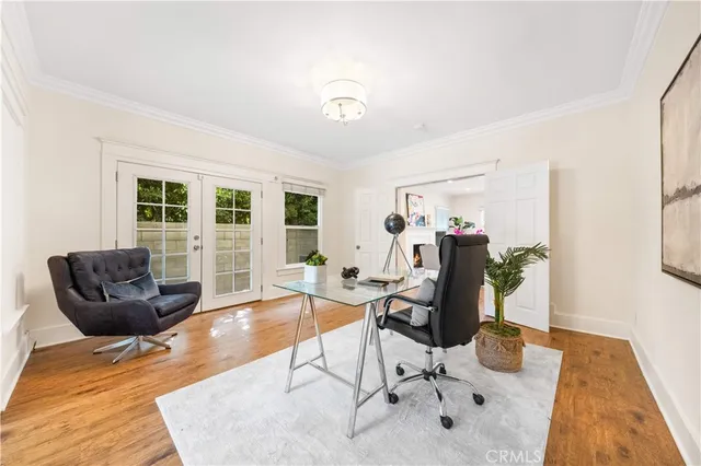 a view of a livingroom with workspace and a couch