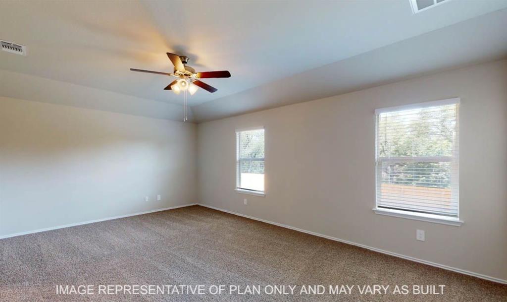 10204 Neptune Court Waco, TX 76708 - Photo 11 of 20 Spacious room featuring carpeting, two windows with blinds, a ceiling fan with integrated lighting, and neutral wall paint