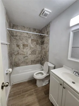 a bathroom with a sink a toilet and a bathtub
