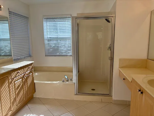a bathroom with a sink and shower