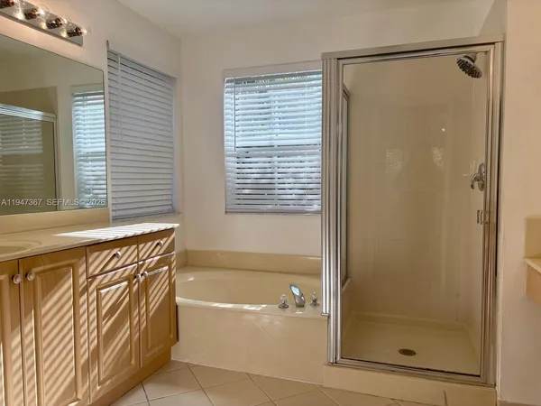 a bathroom with a sink a vanity and a mirror