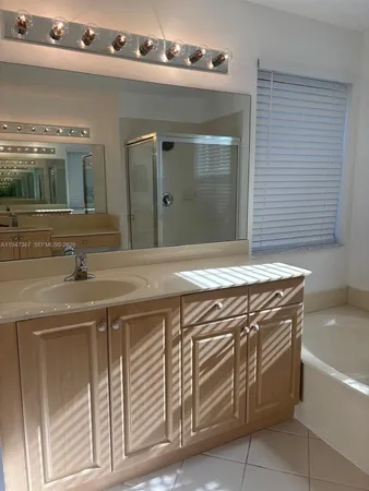 a view of cabinets and wooden floor