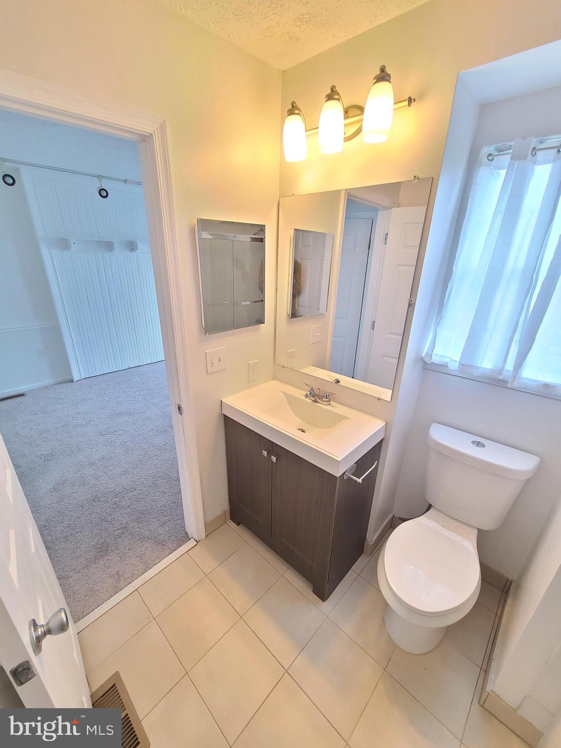 18042 Ohara Circle Olney, MD 20832 - Photo 26 of 35 a bathroom with a sink a toilet and bathtub