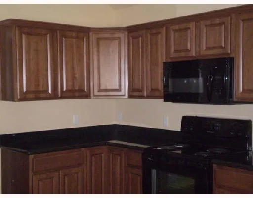 a kitchen with a sink and a microwave