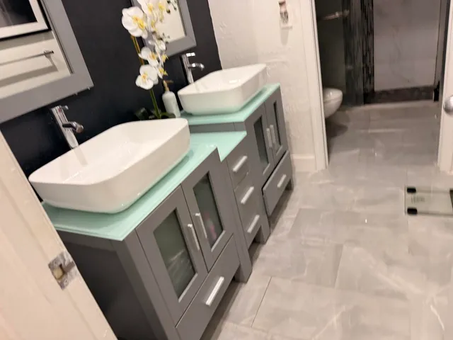 a bathroom with sink and mirror