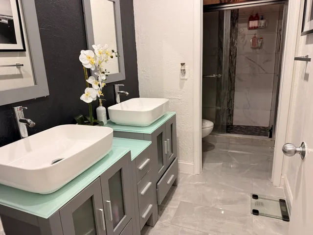 a bathroom with sink and mirror