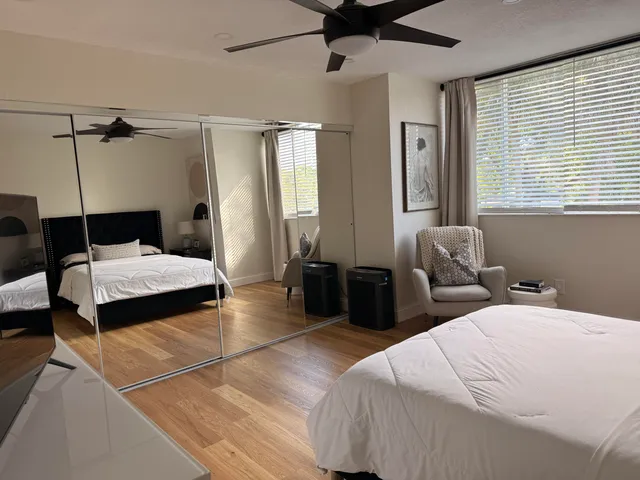 a bedroom with double bed and a window