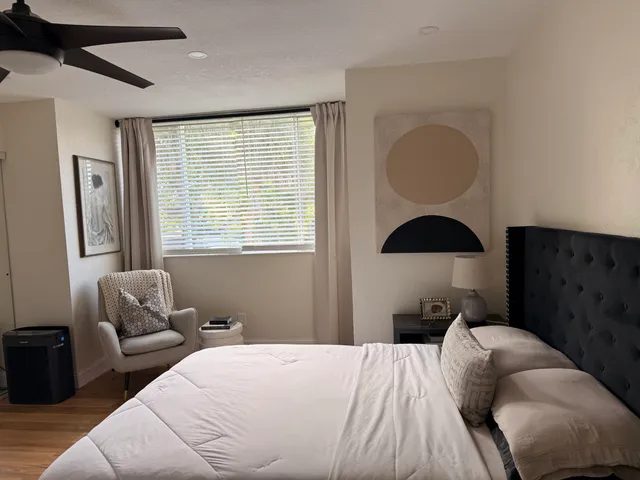 a bedroom with a bed and window