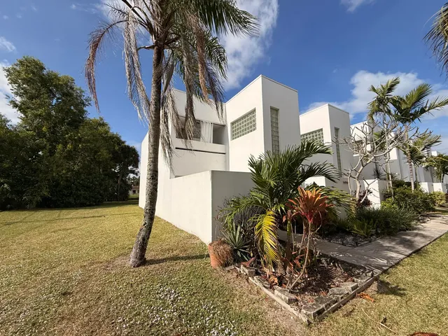 a house with a tree in front of it