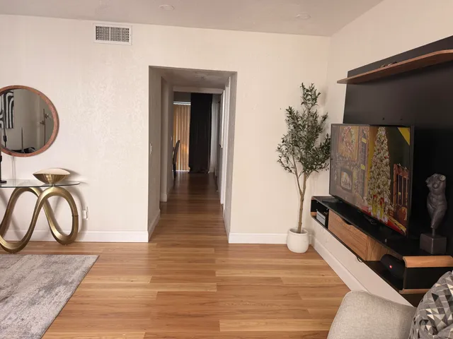 a view of a entryway door with wooden floor