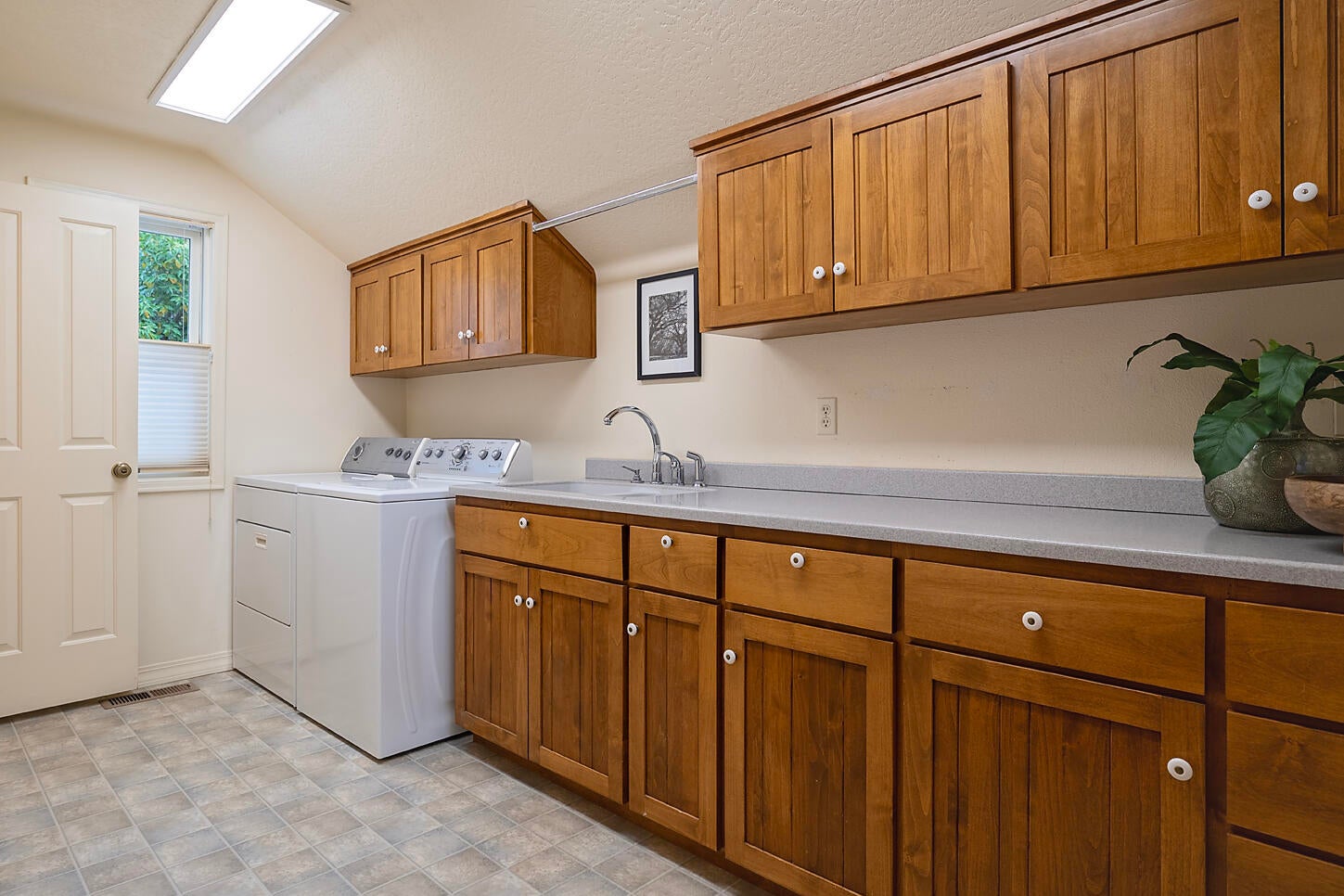 250 Maple Street Central Point, OR 97502 - Photo 13 of 54 Oversized laundry with expansive storage. Access to the unfinished basement with wine storage.