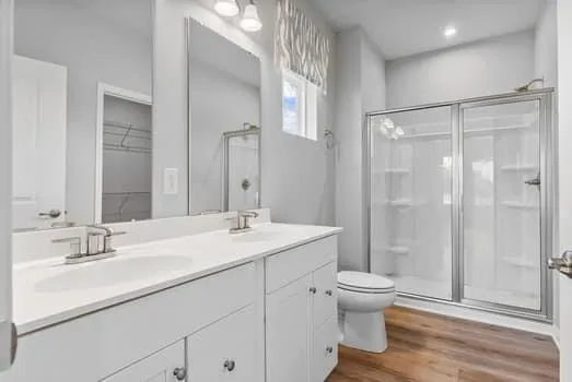 a bathroom with a toilet sink and a mirror