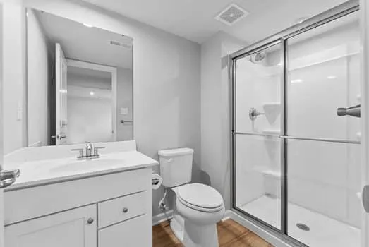 a view of an empty room with a fireplace