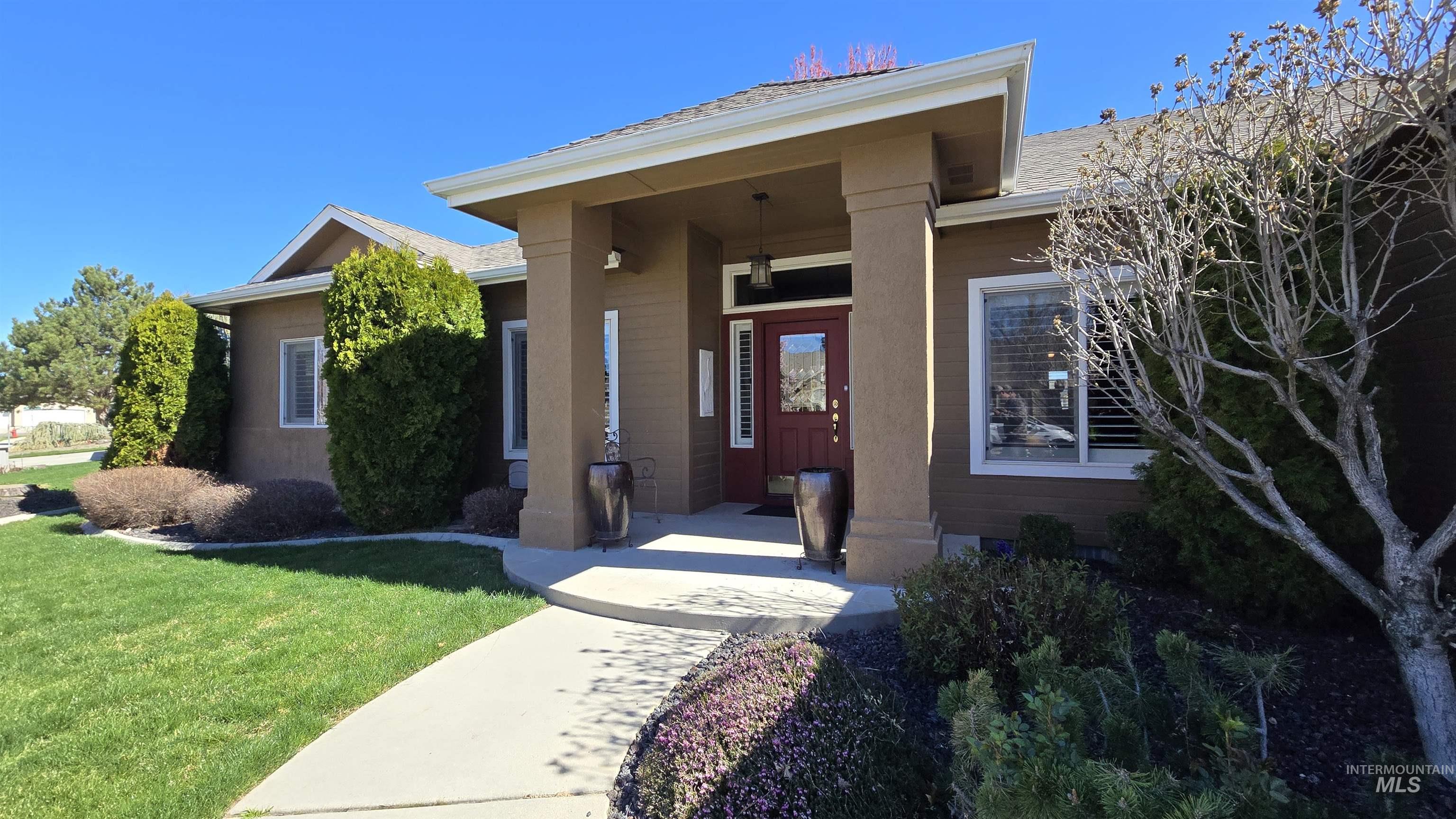 2898 North Silverleaf Way Meridian, ID 83646 - Photo 4 of 26 Entrance to property featuring a yard and covered porch