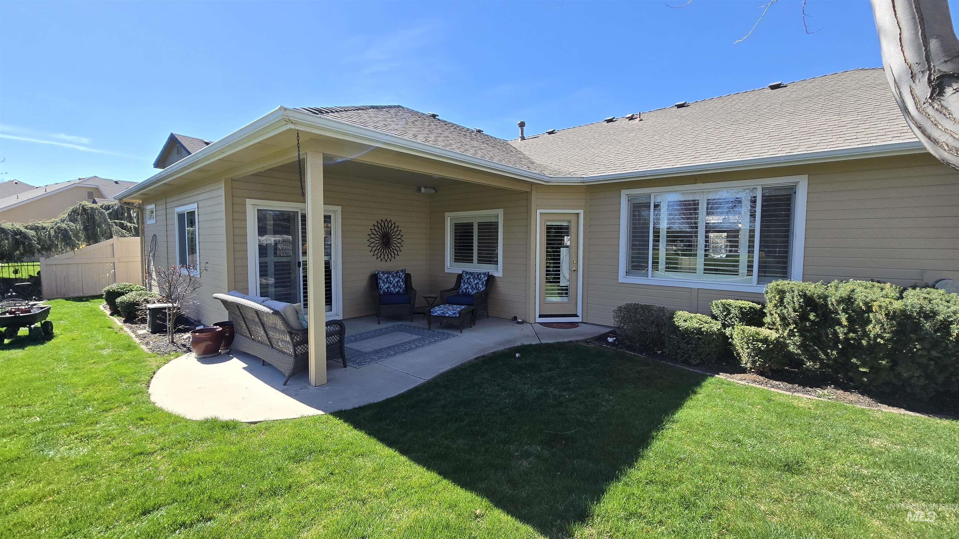 2898 North Silverleaf Way Meridian, ID 83646 - Photo 5 of 26 Rear view of house with a patio area and roof with shingles