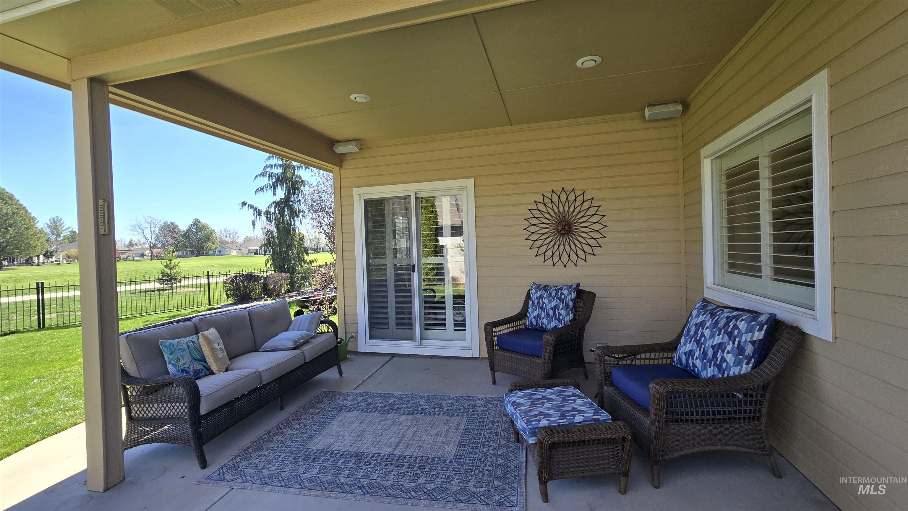 2898 North Silverleaf Way Meridian, ID 83646 - Photo 6 of 26 View of patio featuring an outdoor hangout area and view of golf course