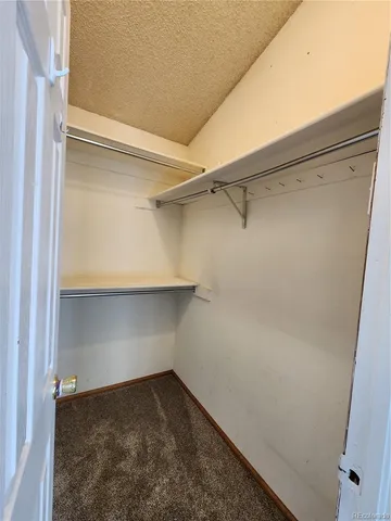 a view of bathroom with toilet sink and mirror