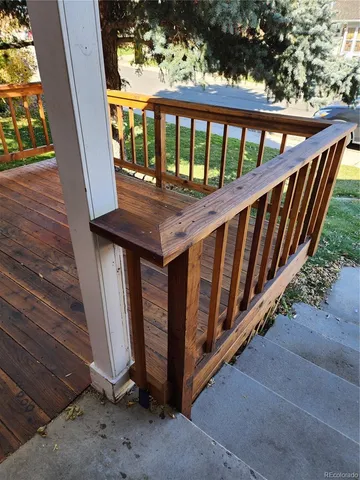 a view of a porch with wooden floor