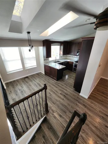 a view of a living room and wooden floor