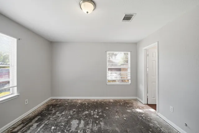 a view of livingroom with an empty space and window