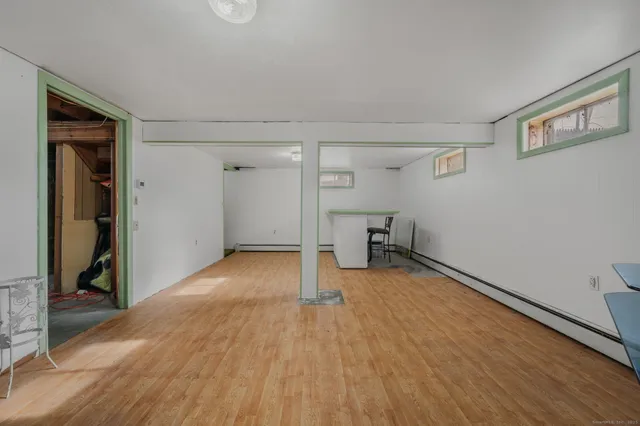 a living room with furniture and a chair