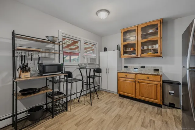 a kitchen with stainless steel appliances granite countertop a stove and cabinets
