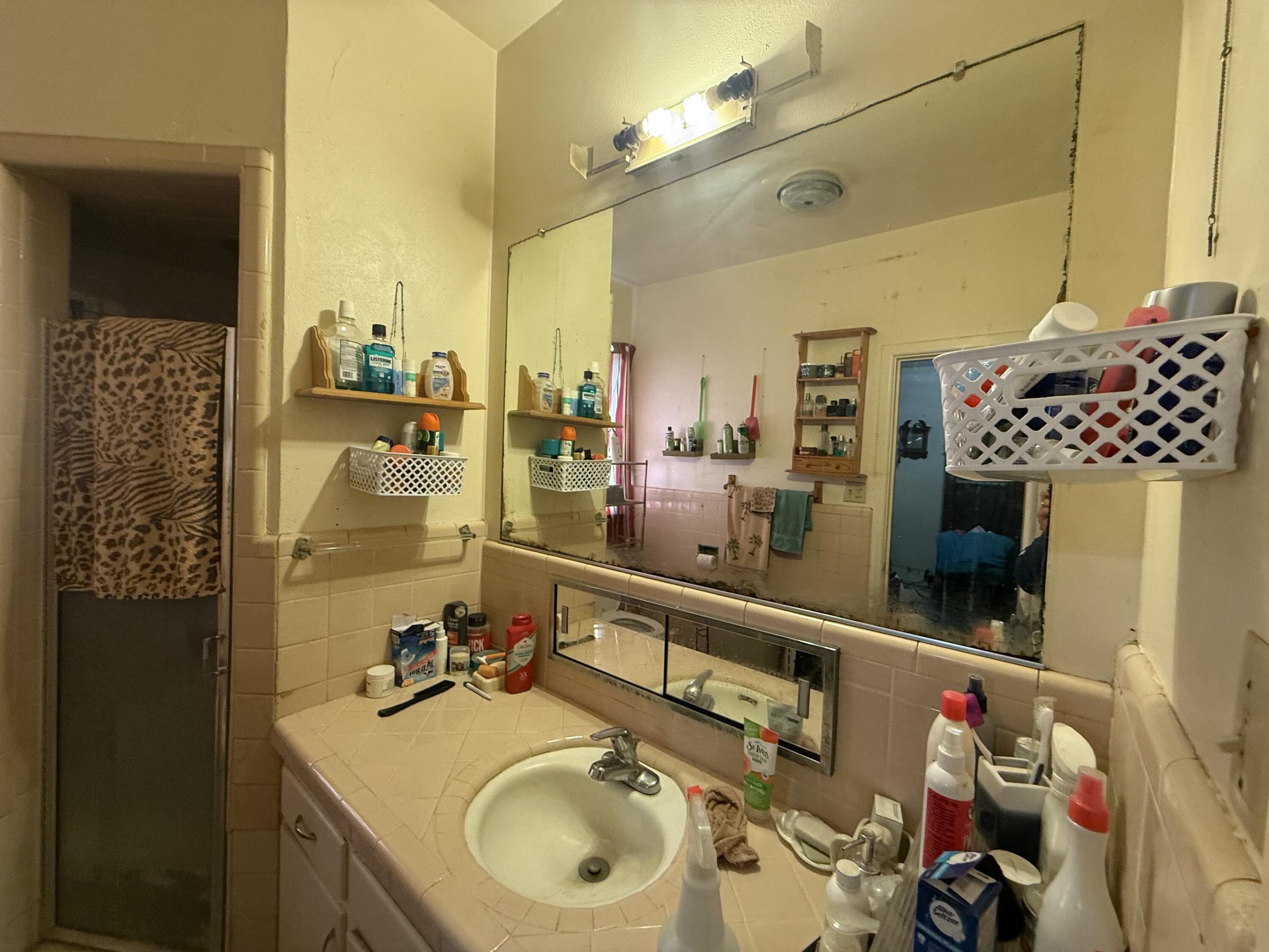 Package Package Property Lubbock, TX 79411 - Photo 34 of 71 a bathroom with a sink double vanity and shower