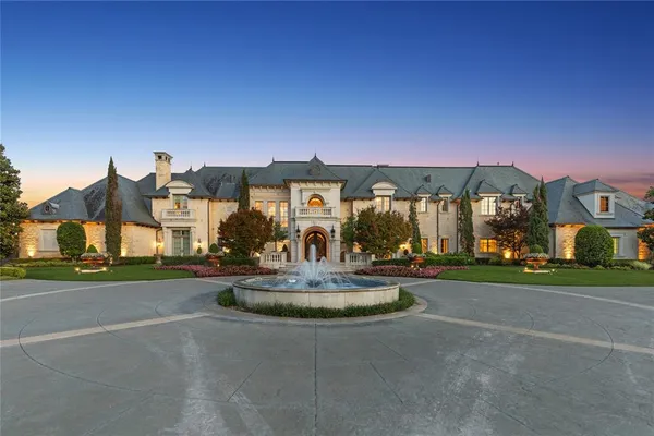 a front view of house with a garden and patio