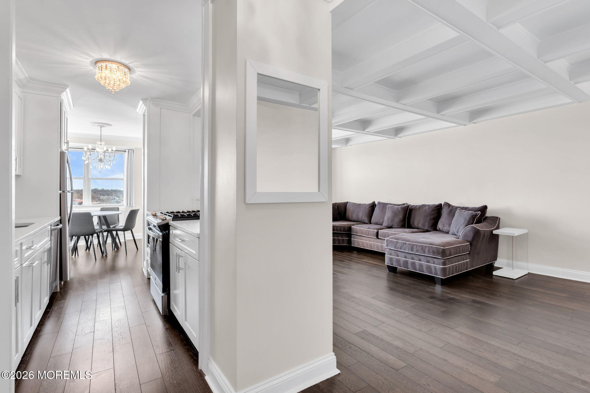 28 Riverside Avenue, Unit 10B Red Bank, NJ 07701 - Photo 11 of 24 a living room with furniture and a wooden floor