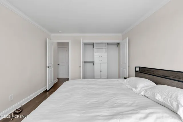 a large white bed in a white room