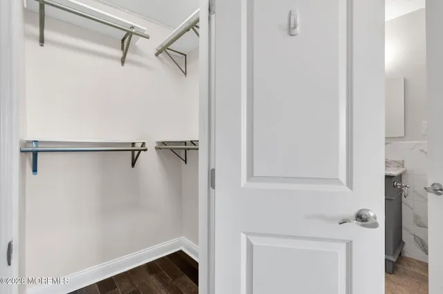 a bathroom with a shower and a sink