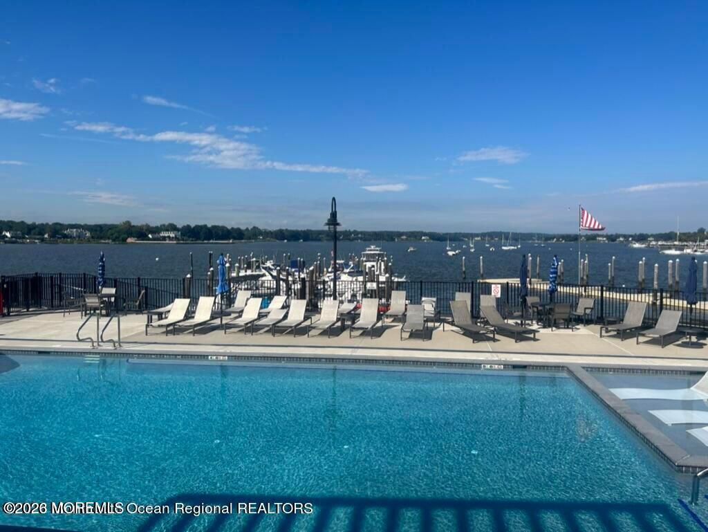 28 Riverside Avenue, Unit 10B Red Bank, NJ 07701 - Photo 21 of 24 a view of a swimming pool with an ocean view