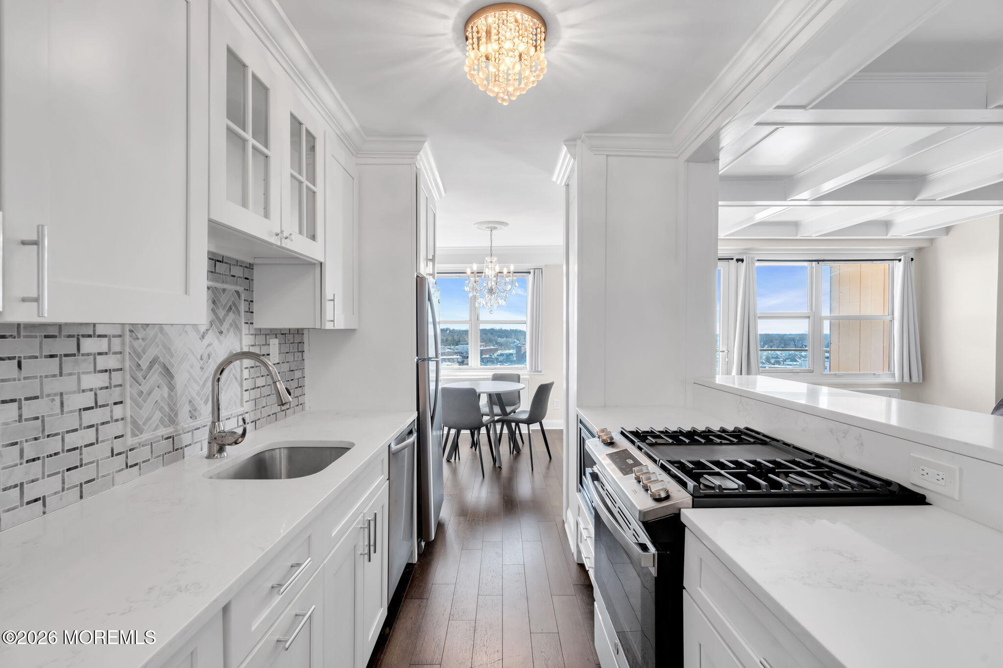28 Riverside Avenue, Unit 10B Red Bank, NJ 07701 - Photo 4 of 24 a kitchen with a stove a sink and a refrigerator